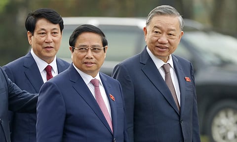 Vietnam's newly elected President Luong Cuong, from left, Prime Minister Pham Minh Chinh and General Secretary of the Communist Party To Lam are seen outside the National Assembly in Hanoi (AP)