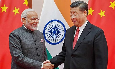 PM Narendra Modi meeting the Chinese President Xi Jinping
