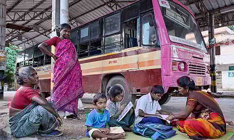Family seek refuge beneath the dimly-lit and poorly-maintained Ayanavaram bus depot (Photo: Hemanathan M)&nbsp;