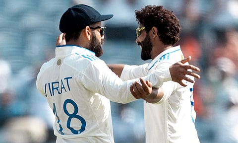 India's Ravindra Jadeja celebrates with Virat Kohli after taking the wicket of New Zealand's Tom Blundell (PTI)
