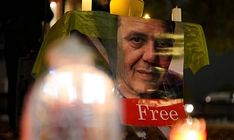 People commemorate Iranian-German Jamshid Sharmahd during a protest following his execution in Iran