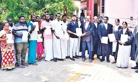 Farmers receive court order copy in Thanjavur on Tuesday&nbsp;