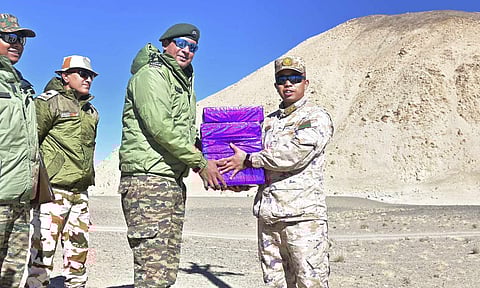 Indian and Chinese Army personnel exchange sweets on the Diwali festival (PTI)