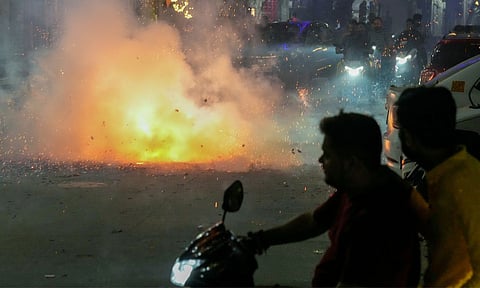 People burst firecrackers during the Diwali festival celebrations, in New Delhi (PTI)