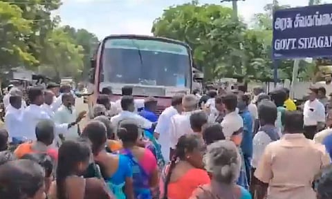 AIADMK supporters blocking the road in Manamadurai seeking action against the murder accused.