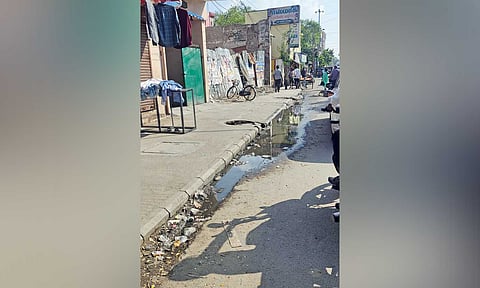 Sewage overflowing from the broken manhole on Chetty Street in Royapuram