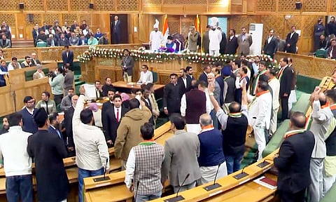Awami Ittehad Party MLA Sheikh Khurshid being marshalled out during a ruckus after BJP members protested over the special status resolution in J-K Assembly, in Srinagar (PTI)&nbsp;