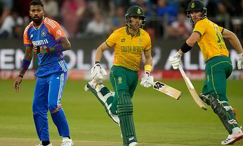 India's Hardik Pandya, left, watches the ball as South Africa's Reeza Hendricks, center, and Tristan Stubbs run between the wickets (PTI)&nbsp;