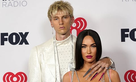 Megan Fox, right, and Machine Gun Kelly attend the iHeartRadio Music Awards (AP)