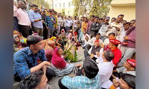 Family members of victims wait at the Maharani Laxmi Bai Medical College, where a fire broke out on Friday killing at least 10 newborns, in Jhansi district (PTI)&nbsp;