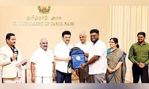 CM Stalin handing over tour kit to a beneficiary at ‘Vergalai Thedi’ event in last August&nbsp;