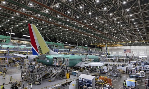 &nbsp;Boeing employees work on the 737 MAX on the final assembly line at Boeing’s Renton plant (AP)