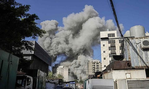 Smoke rises from a building that collapsed following an Israeli airstrike in Chiyah, south of Beirut, Lebanon on Sunday (AP)