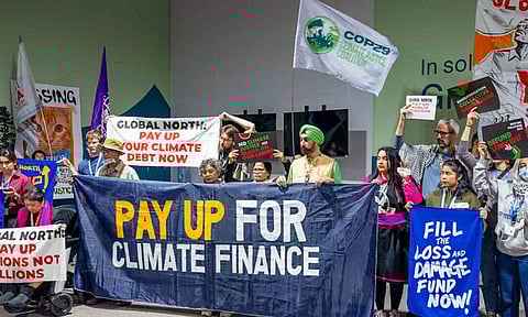 Civil society members stage a silent march at the UN climate summit (PTI)