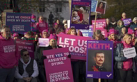 Pro legal assisted dying supporters demonstrate in front of Parliament in London (AP)&nbsp;