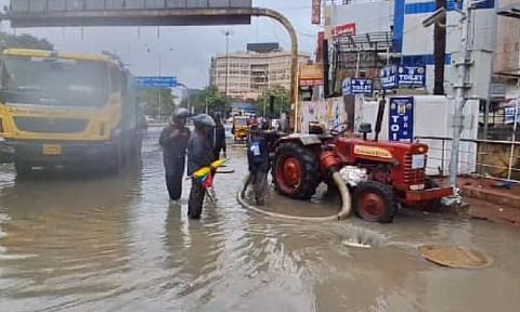 GCC workers clearing stagnant water at GP Road.