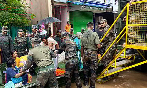 Indian Army personnel rescue people from a flooded area in the aftermath of Cyclone Fengal