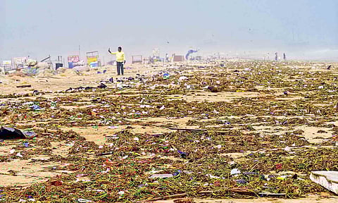 The Marina Beach shore was covered by trash after the storm which was cleaned by Corporation workers on Monday (Photo: Justin George)&nbsp;