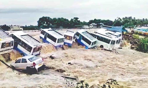 Cars, vans caught in the current in Uthangarai, Krishnagiri, following heavy rain in the aftermath of Cyclone Fengal
