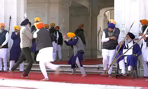 People catch a man who allegedly opened fire at Shiromani Akali Dal leader Sukhbir Singh Badal (PTI)&nbsp;