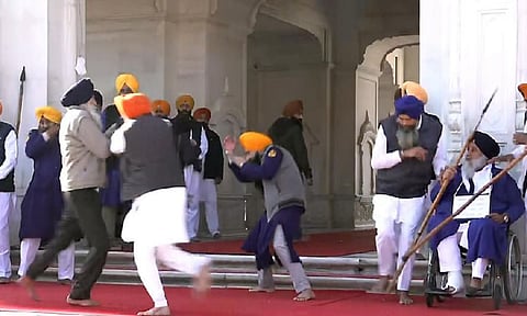 People catch a man who allegedly opened fire at Shiromani Akali Dal leader Sukhbir Singh Badal (PTI)&nbsp;