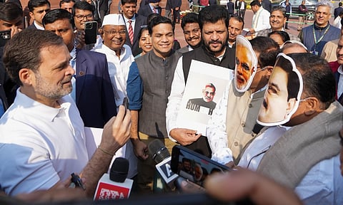Leader of Opposition Rahul Gandhi takes a mock interview of Congress MPs Manickam Tagore and Saptagiri Sankar Ulaka, wearing face masks of Prime Minister Narendra Modi and Adani Group Chairman Gautam Adani, at a protest demanding a probe following the indictment of Adani and other company officials in a US court during the Winter session of Parliament&nbsp;(PTI)