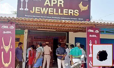 The jewel shop looted by burglars. (Right) Hole drilled to gain access