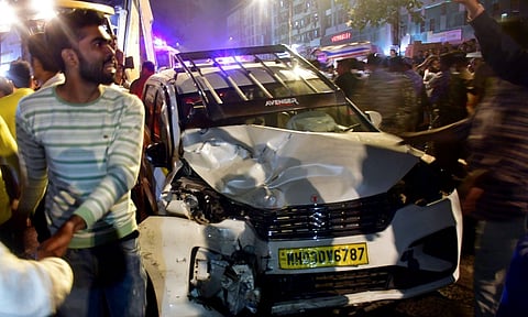 Locals gather at the spot after a speeding Brihanmumbai Electricity Supply and Transport Undertaking (BEST) bus collided with several vehicles on a road at Kurla (PTI)
