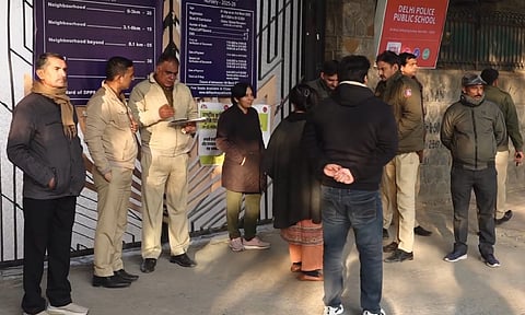 Security personnel conduct investigation outside the Delhi Police Public School (PTI)