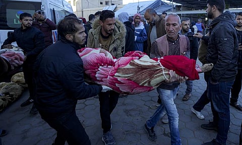 Palestinians carrying the person killed in bombardment of Gaza Strip (AP)