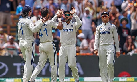 Akash Deep, second left, celebrates with teammates after the dismissal of Australia's Nathan McSweeney during play on day five of the third cricket test between India and Australia