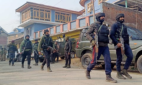 Security forces personnel during an encounter with terrorists at Kadder in Kulgam district on Thursday (PTI)