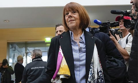 Gisele Pelicot, who was allegedly drugged by her now former husband, arrives at the court house wearing a scarf printed with artwork of Martu Woman (AP)