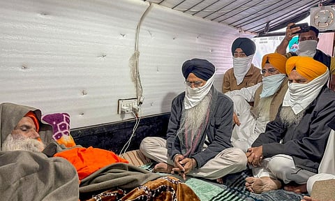 Shiromani Gurdwara Parbandhak Committee (SGPC) President Harjinder Singh Dhami meets farmer leader Jagjit Singh Dallewal, who is on an indefinite fast at Khanauri border at Khanauri border since November 26, in Sangrur district, Punjab, Wednesday, Dec. 18, 2024. (PTI Photo)