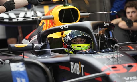 Red Bull driver Isack Hadjar of France prepares during the first free practice ahead of the Formula One Abu Dhabi Grand Prix, at the Yas Marina Circuit in Abu Dhabi (AP)