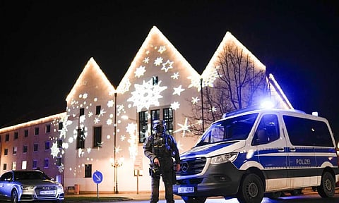 A police officer at the blocked road near Christmas market after the accident in Germany (AP)