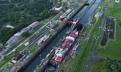 A cargo ship traverses the Agua Clara Locks of the Panama Canal in Colon, Panama (AP)