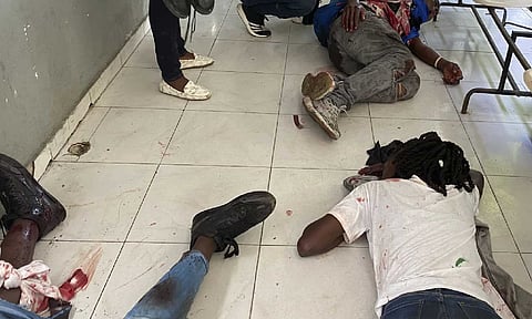 Journalists lie wounded after being shot by armed gangs at the general hospital in Port-au-Prince, Haiti (AP)&nbsp;