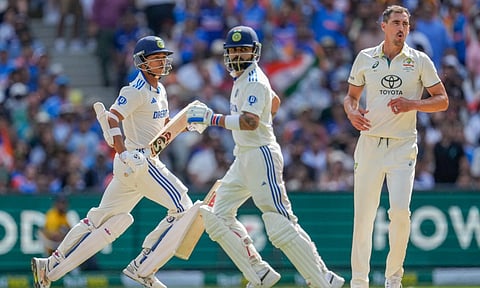 India's Yashasvi Jaiswal, left, India's Virat Kohli, center, run between the wickets to score as Australia's Mitchell Starc looks on during play on the second day of the fourth cricket test between Australia&nbsp;and&nbsp;India (AP)