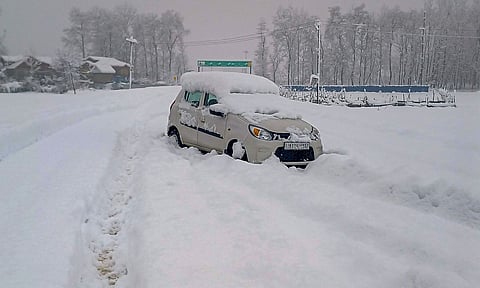 A vehicle stranded on the Jammu-Srinager National Highway after heavy snowfall, in Anantang district (PTI)