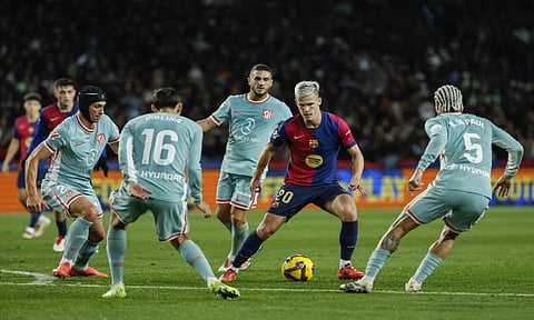 Barcelona's Dani Olmo, controls the ball during the Spanish La Liga soccer match between Barcelona and Atletico Madrid at the Lluis Company Olympic Stadium in Barcelona, Spain (AP Photo)