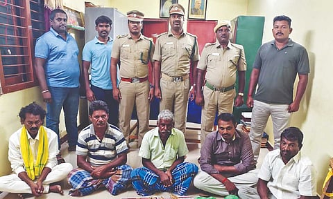 The arrested persons with the seized tusks&nbsp;