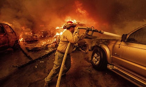 A firefighter battles the Eaton Fire in Altadena, Calif (AP)