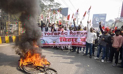 Supporters of MP Pappu Yadav block a road during a 'Bihar Bandh' called by him in support of the students seeking cancellation of the 70th Combined Competitive Examination (CCE) 2024, conducted by the Bihar Public Service Commission (BPSC), in Patna (PTI)