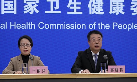 Gao Xinqiang, deputy director of the Department of Medical Emergency Response of the health commission, right, speaks next to Wang Liping, researcher for the Chinese Center for Disease Control and Prevention during a press briefing by the National Health Commission (AP)&nbsp;