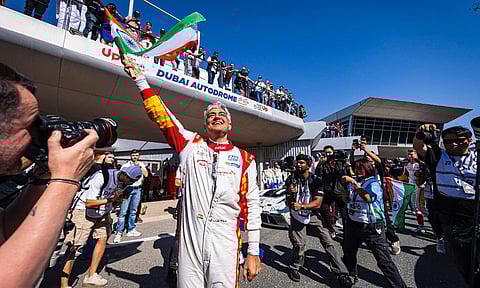 Ajith Kumar waving the Indian flag after race win&nbsp;