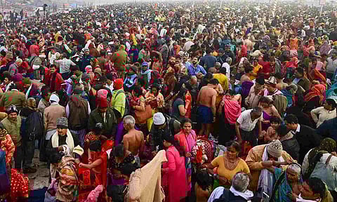 Devotees gather to take a holy dip at the Sangam on the first day of Maha Kumbh Mela 2025, in Prayagraj (PTI)