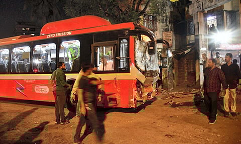 A damaged car being checked at the site after a Brihanmumbai Electric Supply and Transport (BEST) undertaking's bus rammed into pedestrians as well as vehicles on a road at Kurla, in Mumbai (PTI)