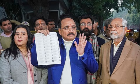 Delhi BJP President Virendra Sachdeva with party leaders Bansuri Swaraj and Om Pathak speaks with the media after meeting Election Commissioners at Nirvachan Sadan (PTI)