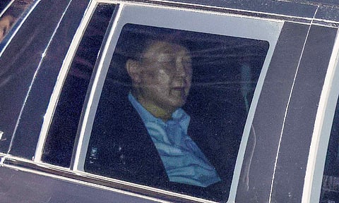 Impeached South Korean President Yoon Suk Yeol, sits in a car as he heads to a detention center in Uiwang (AP)&nbsp;